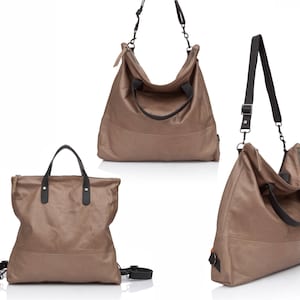 May include: Three brown leather tote bags with black straps and handles. The bags are all different sizes and shapes.