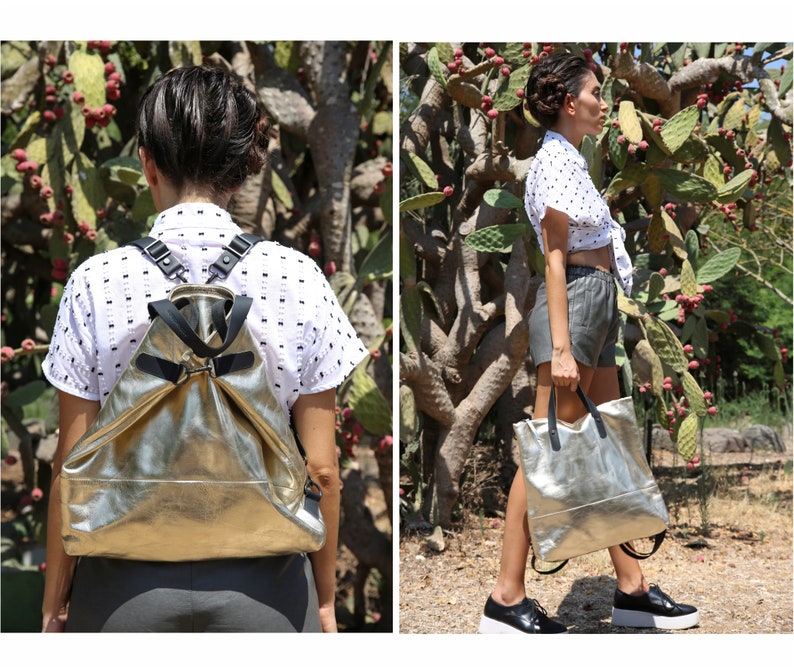 May include: Two views of a silver metallic leather backpack with black straps. The backpack is worn by a person in the first image and held by a person in the second image.