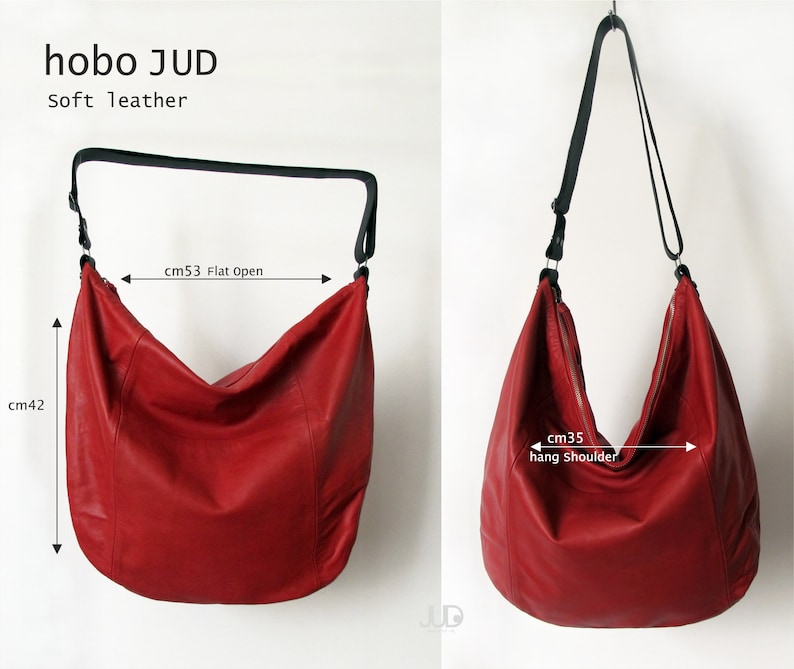 May include: Red leather hobo bag with a black adjustable strap. The bag measures 53 cm wide when laid flat and 42 cm tall. The strap is 35 cm long when hanging on the shoulder.