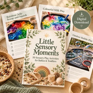 May include: A book titled Little Sensory Moments with 50 Sensory Play Activities for Babies & Toddlers, surrounded by three activity sheets titled Rainbow Jelly Scoop and Squish, Colourful Milk Play, and Outdoor Bubble Play.