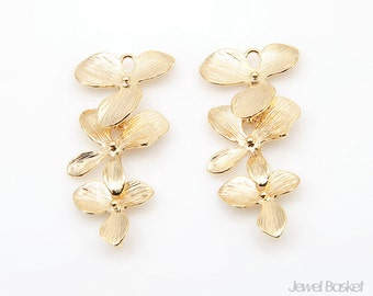May include: Gold-toned metal flower charms, each with five petals, arranged in a cascading design. The charms are perfect for jewelry making or crafting.
