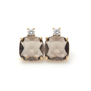 May include: A pair of gold earrings with a square-shaped smoky quartz gemstone and a small round clear diamond accent.