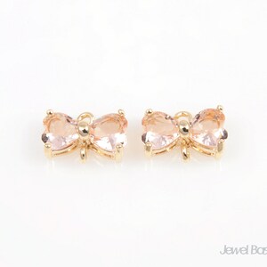 SLPG042-C (2 Stück) / 10mm x 7mm / 10mm x 7mm Schmetterling Anhänger in der Farbe helles Pfirsich mit goldfarbenem Rahmen