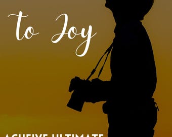 May include: A book cover featuring a silhouette of a person holding a camera against a golden sunset. The text reads Pathways to Joy, ACHEIVE ULTIMATE HAPPINESS, and DAN BLAKE. The design uses a warm color palette with dark outlines.