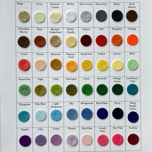 May include: A color chart with 6 rows and 10 columns of felt circles. Each circle is labeled with a color name, such as Beige, Ivory, Natural/Cream, White, Silver Grey, Slate Grey, Black, Dark Brown, Chocolate Brown, Rust, Biscuit/Gingerbread, Flesh/Vanilla, Garnet, Red, Pumpkin, Orange, Coral, Peach, Mustard, Papaya/Gold, Sunflower, Yellow, Lemon, Mint, Sweet Pea, Sage, Lime, Asparagus, Grass, Emerald, Foliage Green, Caribbean/Teal, Turquoise, Pale Blue, Light Turquoise, Sky, Wedgwood, Royal Blue, Navy, Deep Purple Velvet, Purple, Lilac, Violet, Thistle, Pale Pink, Candy Pink, Hot Pink, and Fuchsia.