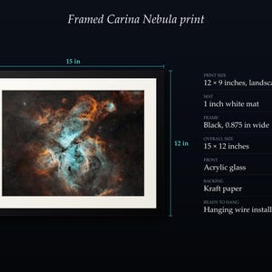 May include: A framed Carina Nebula print measuring 15 by 12 inches overall. The landscape print is 12 by 9 inches with a 1-inch white mat and a 0.875-inch wide black frame. It features acrylic glass, a kraft paper backing, and hanging wire.