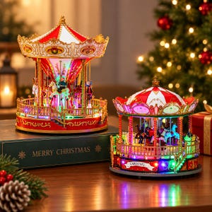 May include: Two illuminated carousel ornaments featuring red and white striped roofs, gold accents, and miniature horses. The larger carousel sits on a green box labeled Merry Christmas, while the smaller one features a banner reading Carousel.