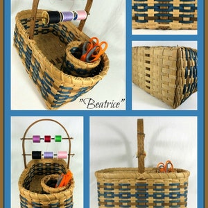 May include: A woven basket with a blue and brown pattern, featuring a handle and a removable spool holder. The basket is filled with spools of thread and a pair of scissors. The basket is labeled "Beatrice".