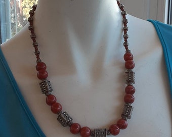 Necklace of 12 coral beads garnished with silver beads, Navajo style, plus a matching bracelet of ten red coral beads, reduced price