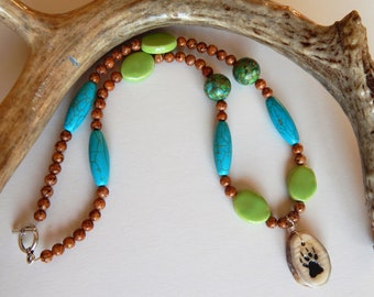 Carved Antler Wolf Print Necklace: Turquoise & Ceramic Beaded Jewelry