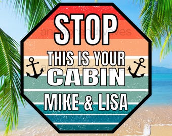 May include: An octagonal sign with a distressed sunset-colored background featuring horizontal stripes in orange, yellow, teal, and blue. The text reads STOP THIS IS YOUR CABIN MIKE & LISA in bold white letters, flanked by two black anchor icons.