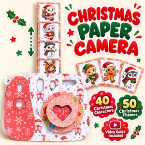 Könnte beinhalten: Ein DIY-Weihnachts-Papierkamera-Bastelset mit weißem Kameragehäuse, roten Schneeflockenmustern, herzförmiger Linse und einem vertikalen Streifen mit vier Weihnachtsfiguren. Enthält drei separate Charakterkarten und beschrifteten Text.
