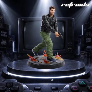 May include: A collectible figurine of a man in a black leather jacket and olive green cargo trousers holding a handgun. The figure stands on a circular base featuring a cracked pavement design with orange flame effects and scattered shell casings.
