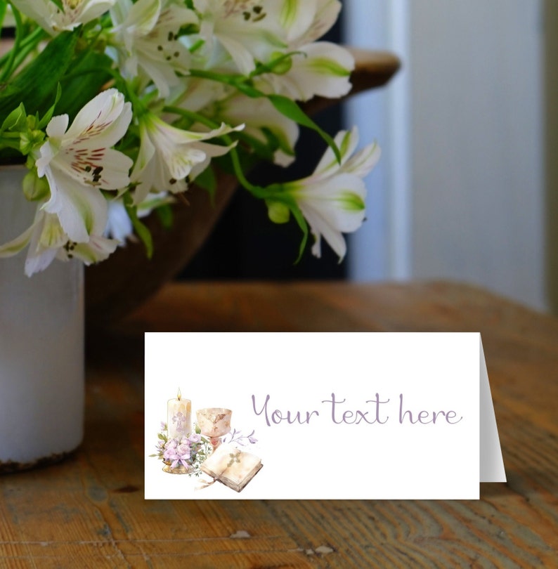 May include: A white card with a watercolor illustration of a candle, a chalice, a book, and flowers. The text "Your text here" is printed in purple on the card.