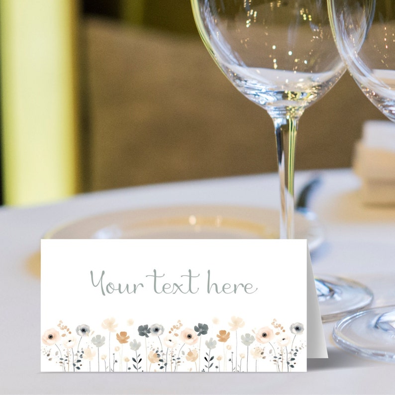 May include: White place card with a gray floral border and the text "Your text here" in gray.