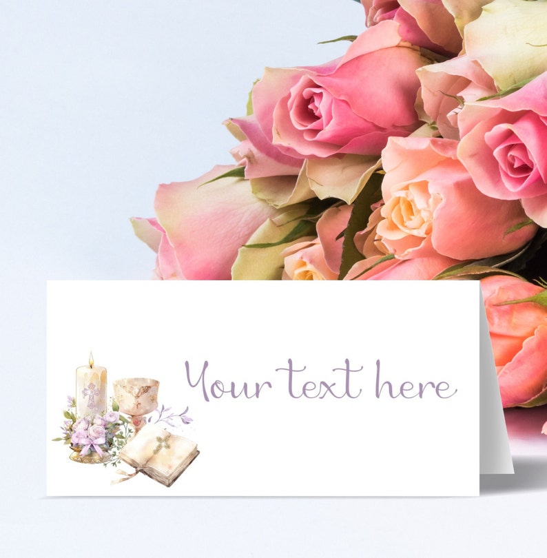 May include: A white card with a watercolor illustration of a candle, chalice, and open book. The text "Your text here" is printed in purple on the card. The card is surrounded by a bouquet of pink roses.