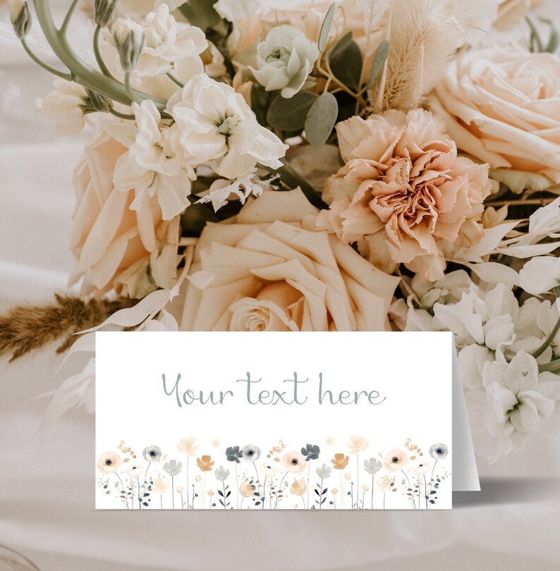 May include: White card with a border of small, colorful flowers. The text "Your text here" is printed in gray on the card.