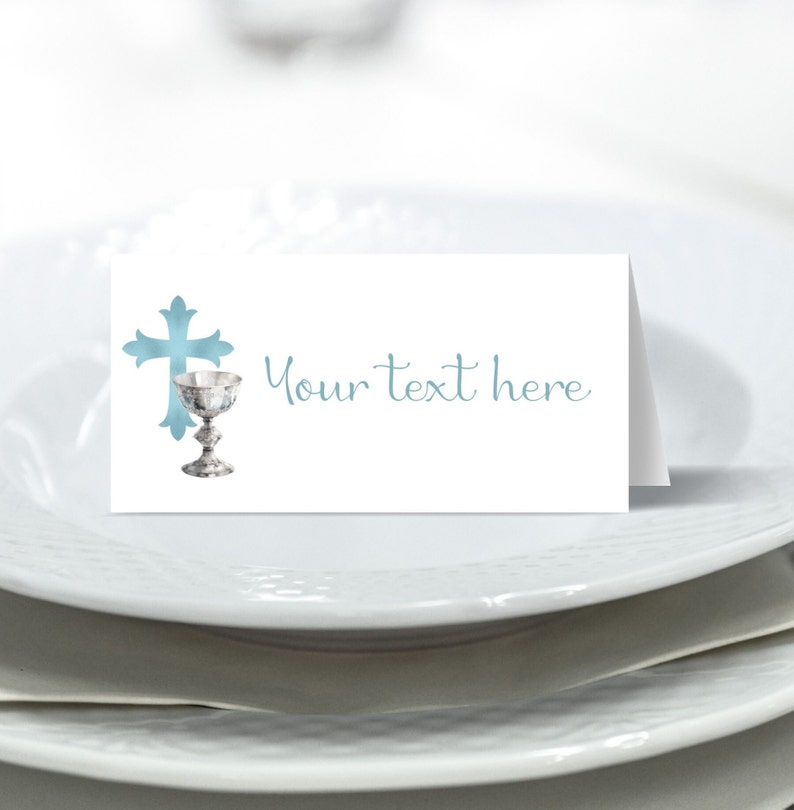 May include: White place card with a blue cross and chalice design. The text "Your text here" is printed on the card.