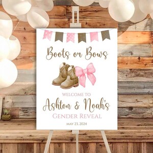 May include: A white sign with pink and brown bunting at the top. The sign says "Boots or Bows" with a pair of brown cowboy boots and a pink bow. The sign also says "Welcome to Ashton & Noah's Gender Reveal May 23, 2024".