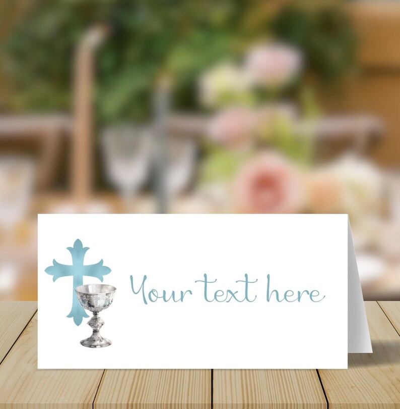 May include: White card with a blue cross and a silver chalice. The text "Your text here" is written in blue cursive.