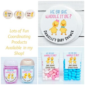 May include: A set of gender reveal party supplies featuring a yellow duck theme. The set includes stickers, favor boxes, hand sanitizer bottles, and candy. The stickers feature the text "He or She Waddle It Be?" and a cartoon image of a yellow duck. The favor boxes are filled with blue and pink candies. The hand sanitizer bottles have labels that say "He or She Waddle It Be?" and feature a cartoon image of a yellow duck. The text "Baby Adams Gender Reveal" is also included on the favor boxes and hand sanitizer bottles.