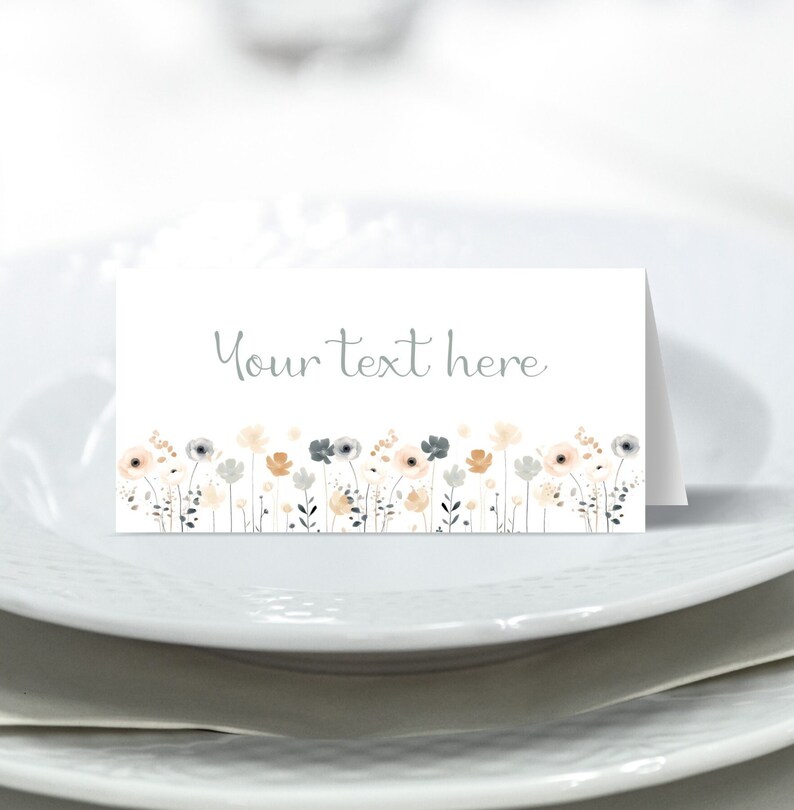 May include: A white place card with a gray floral border and the text "Your text here".