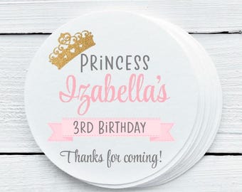 May include: Round white favor tag with a pink ribbon and the text "Princess Isabella's 3rd Birthday Thanks for coming!" in gray and pink text. A gold glitter crown is at the top of the tag.