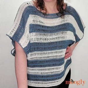 May include: A blue and white striped crochet top with a loose, relaxed fit. The top has a wide, round neckline and short sleeves.