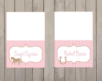 May include: Two pink and brown printable food labels with a white background. The left label has a brown horse silhouette and the text "Cowgirl Cupcakes". The right label has a brown horseshoe and the text "Baked Beans".