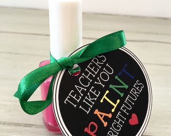 May include: A pink nail polish bottle with a green ribbon and a round tag that says "Teachers like you paint bright futures" with a rainbow-colored paintbrush design.