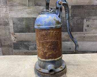 May include: A vintage blue and brown hand pump with the words "PERFECT" and "MYERS PFG. CO. ASHLAND, OHIO" on the side.