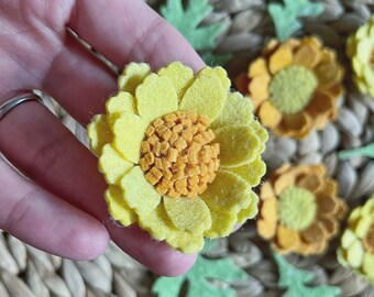 Spring flower pack, yellow and orange felt loose flowers with green leaves