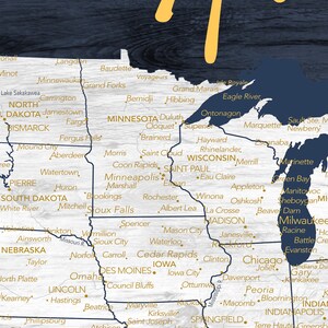 May include: A map of the Midwestern United States with state borders outlined in navy blue and city names in gold. The map is on a woodgrain background.