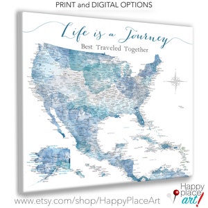 May include: A watercolor map of the United States with the text "Life is a Journey, Best Traveled Together". The map is in shades of blue and gray, with the names of cities and states written on it. The map is surrounded by a white border.
