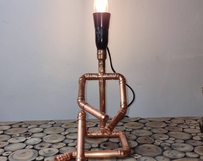Copper Pipe Sitting Man Lamp