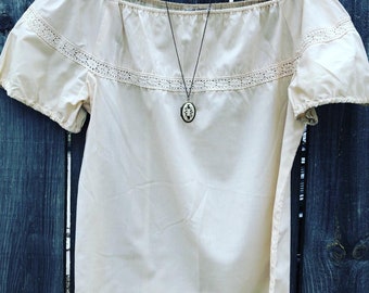cream colored peasant blouse