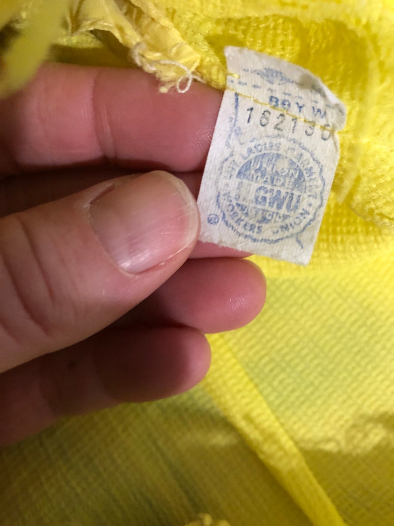 1970s yellow crepe pleated mini dress with ruffle and bow drop waist