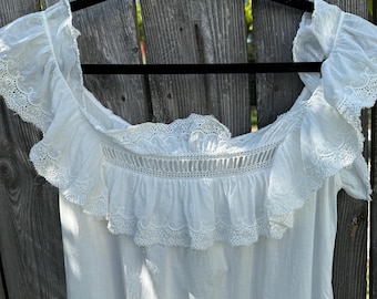 Edwardian white cotton embroidered gown with ruffle details