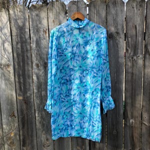vintage and handmade 1960s sheer long sleeve blue floral watercolor shift dress with mockneck