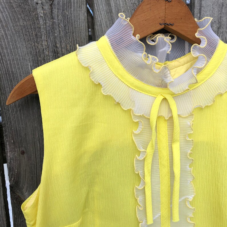 1970s yellow crepe pleated mini dress with ruffle and bow drop waist
