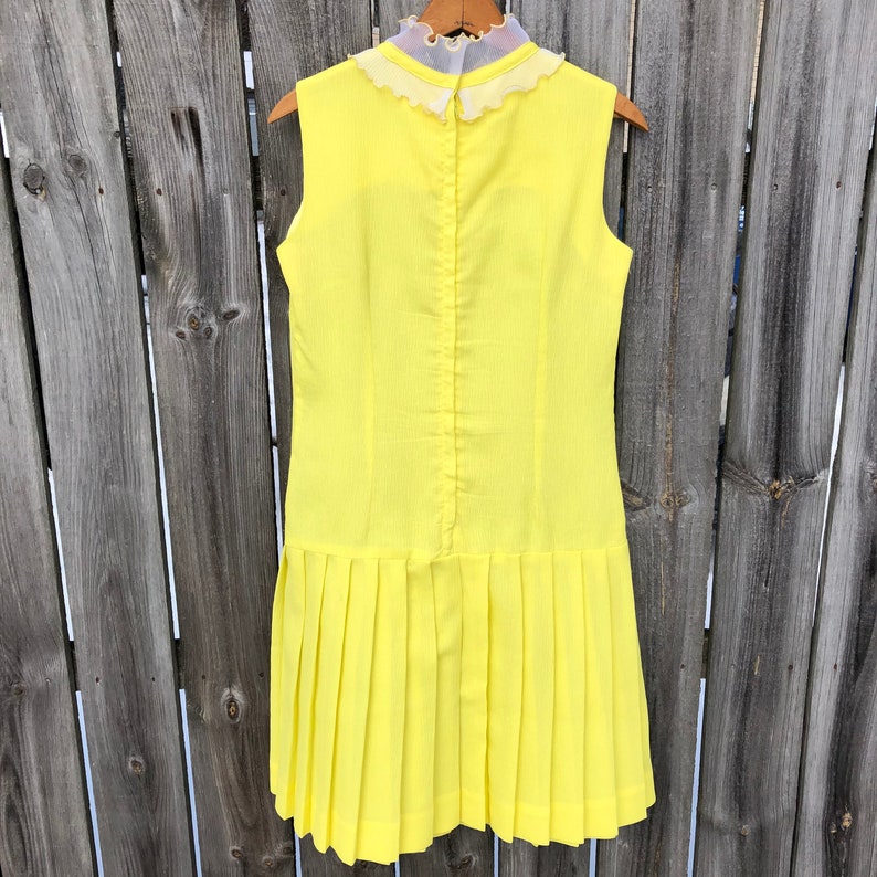 1970s yellow crepe pleated mini dress with ruffle and bow drop waist