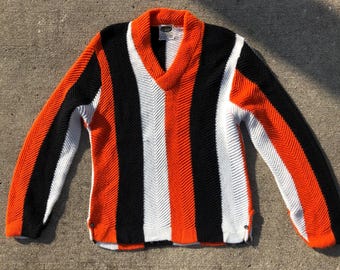 1960s vintage bold striped orange, black, and white striped v-neck acrylic sweater
