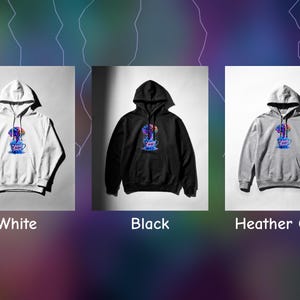 Peut inclure: Trois sweats &agrave; capuche en blanc, noir et gris chin&eacute;. Chacun pr&eacute;sente un motif central d'un cerveau color&eacute; sortant d'une tasse de caf&eacute; avec le texte "ADHD Brain" imprim&eacute; sur la tasse. Les sweats incluent des manches longues, une poche kangourou et une capuche &agrave; cordon.