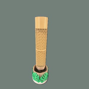 May include: A tall, cylindrical beige plant support featuring a repeating honeycomb pattern throughout its length. The base is a circular, textured tan pot decorated with several bright green, three-dimensional monstera leaves.