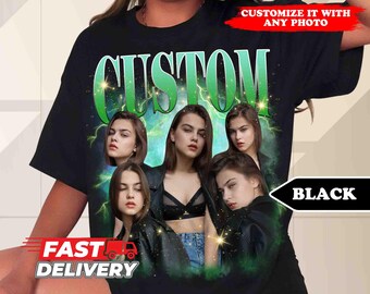 May include: Black t-shirt with a green "CUSTOM" graphic featuring four women's faces. The graphic has a retro, vintage aesthetic with lightning bolts and stars.
