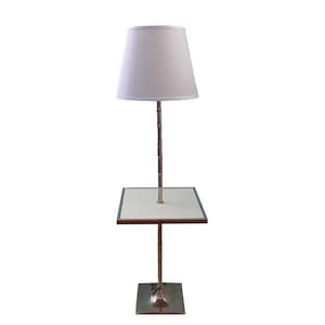 May include: A white lampshade with a silver metal base and a square table top. The lamp is on a white background.