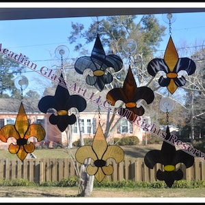 Zwart en goud (Saints) Fleur de Lis glas-in-lood zonnevangers