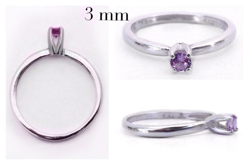 May include: A silver ring with a 3 mm amethyst gemstone. The ring is simple and elegant, with a delicate band and a single stone.