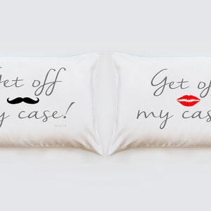May include: Two white pillowcases with the text "Get off my case!" printed on them. One pillowcase has a black mustache and the other has a red lipstick kiss.