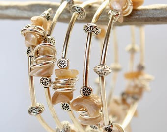 Silver and mother of pearl beads on memory wire